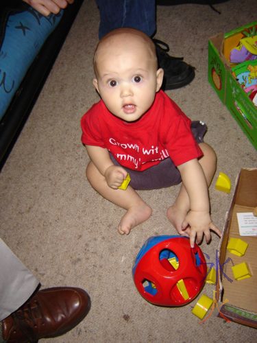 baby playing with shape sorter