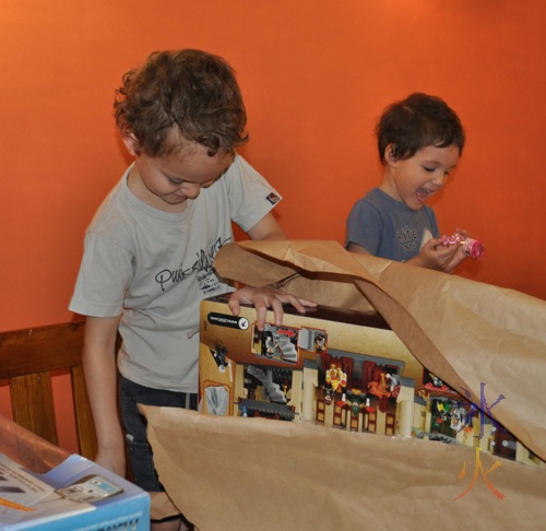 excited kids opening presents at Christmas