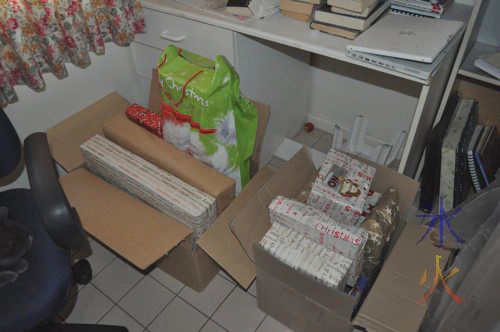Two bardboard boxes full of Christmas presents, in lieu of being under a tree Two bardboard boxes full of Christmas presents, in lieu of being under a tree