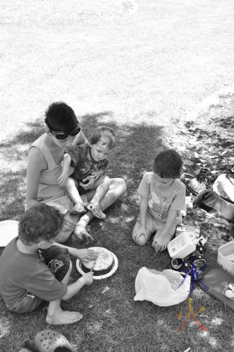 6yo cutting his cake - black and white because JJ forgot to change the camera setting