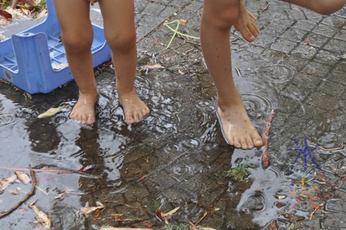 6yo and 4yo jumping in the puddle