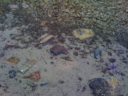 Broken bricks and rocks embedded in the trail