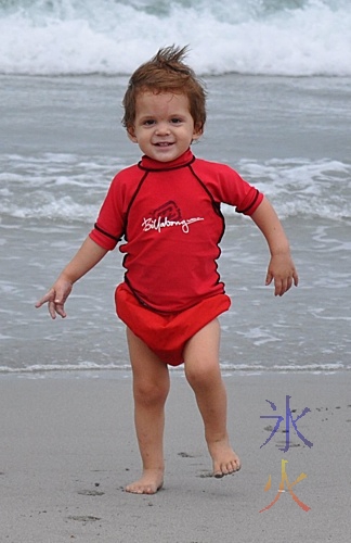 toddler at the dog beach