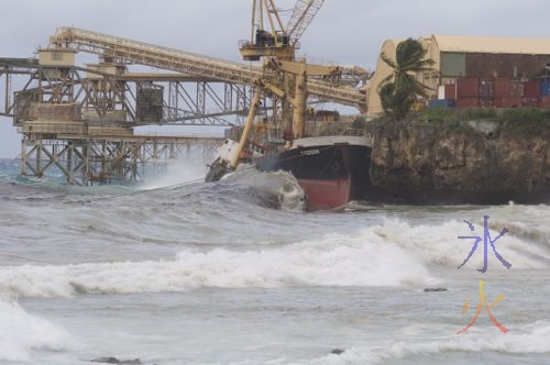 Broken ship atFlying Fish Cove on Christmas Island, surrounded by the oil it spilled