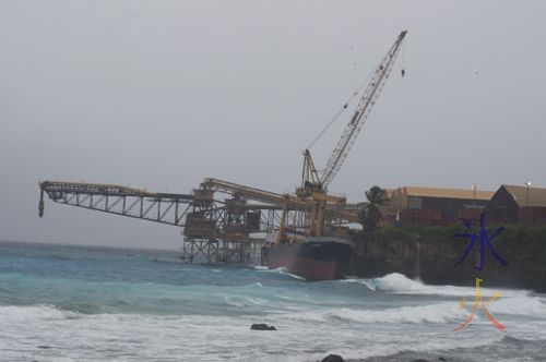 Ship getting battered into a cliff by waves during a storm