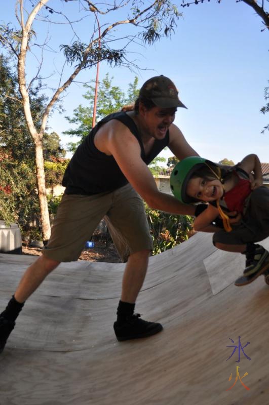 Toddler learning how to skate the ramp