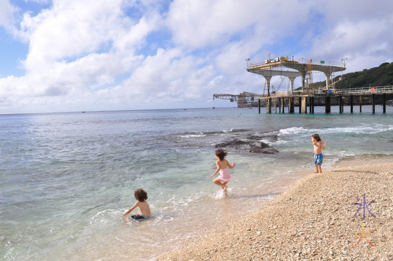 Cantilever and jetty from Flying Fish Cove with three cute kids in the foreground