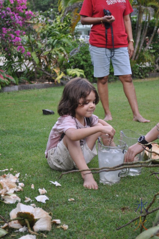 Stirring and taste testing the coconut milk