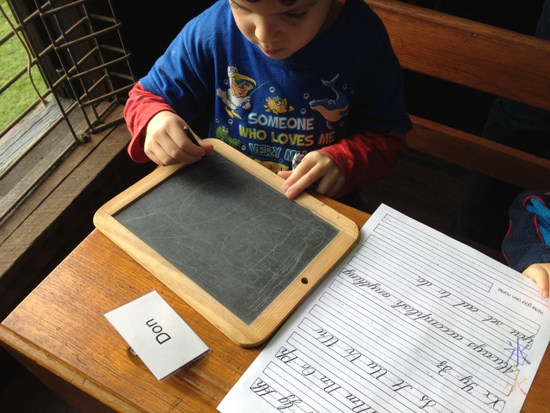 Wilkinson Homestead writing practice on a slate