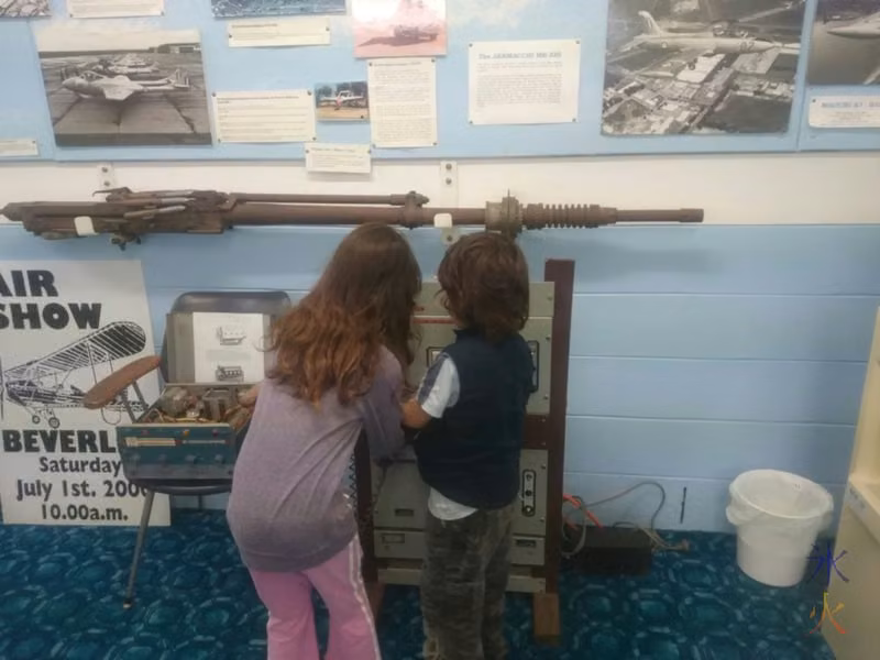 Kids playing with a communication device at the aircraft museum in Beverley, Western Australia