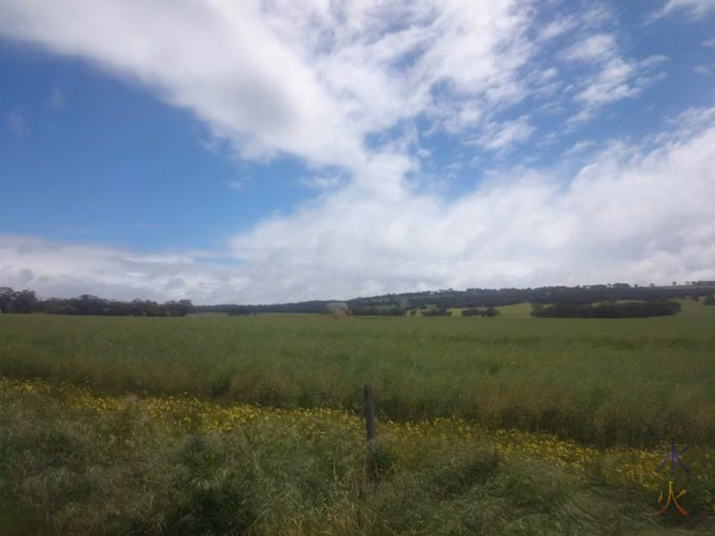 Bad photo of a big rock in a paddock on the way into Beverley, Western Australia