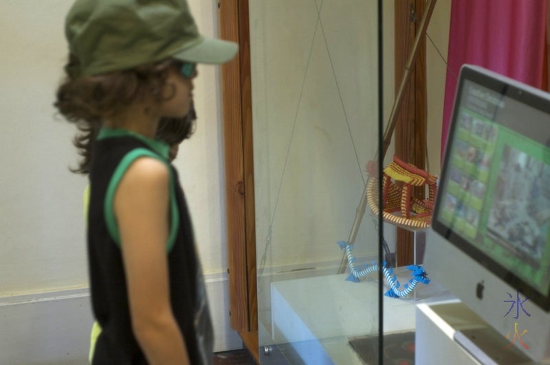 Looking at a computer display at Tai Jin House Museum, Christmas Island, Australia