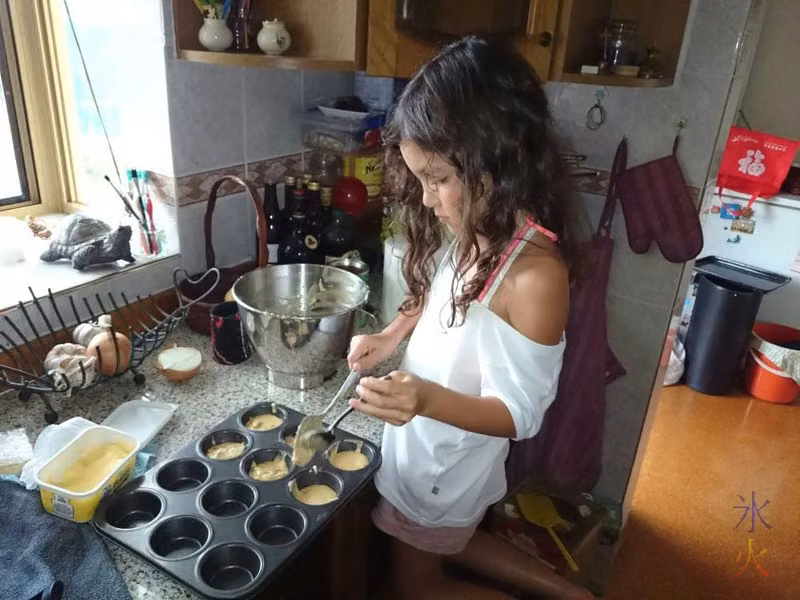 8yo helping Nanny make cupcakes