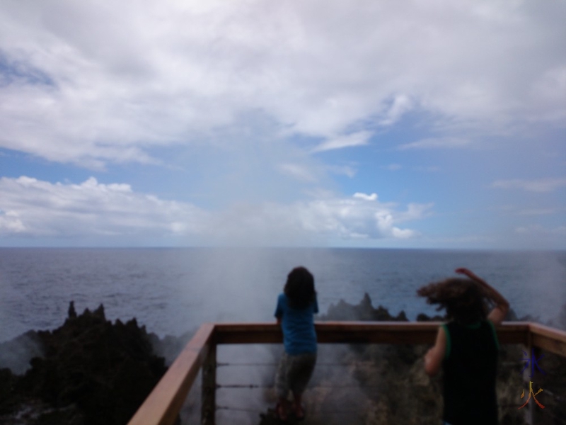 boys looking at Blowholes, Christmas Island, Australia