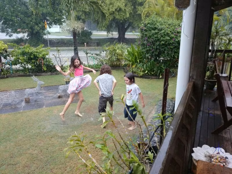 Jumping in a huge puddle in the garden