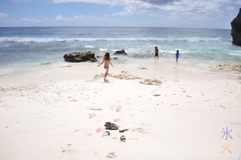 Kids playing at Greta Beach, Christmas Island, Australia