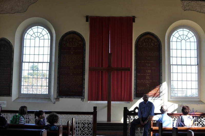 Listening to the your guide talking about the Church of England chapel in Fremantle Prison, Western Australia