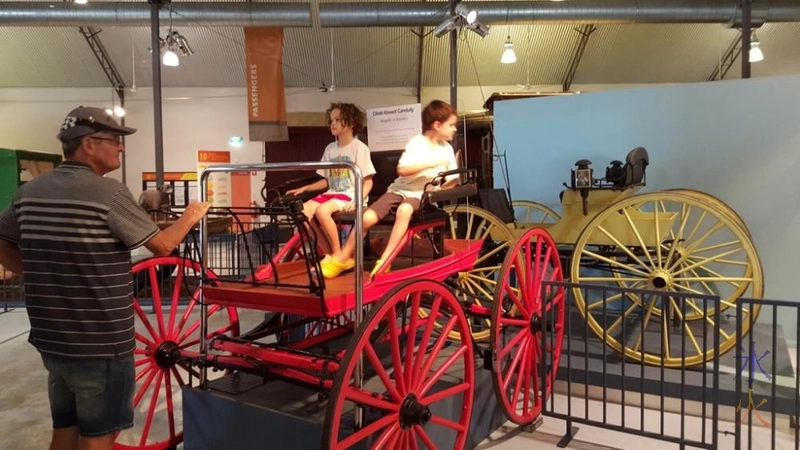 Sitting in a horse cart at the transport museum in Whiteman Park, Western Australia