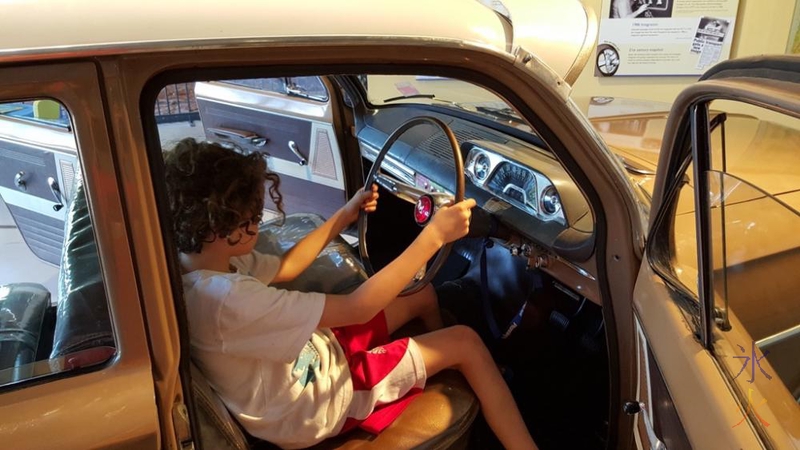 11yo investigating the old car at the transport museum at Whiteman Park, Western Australia