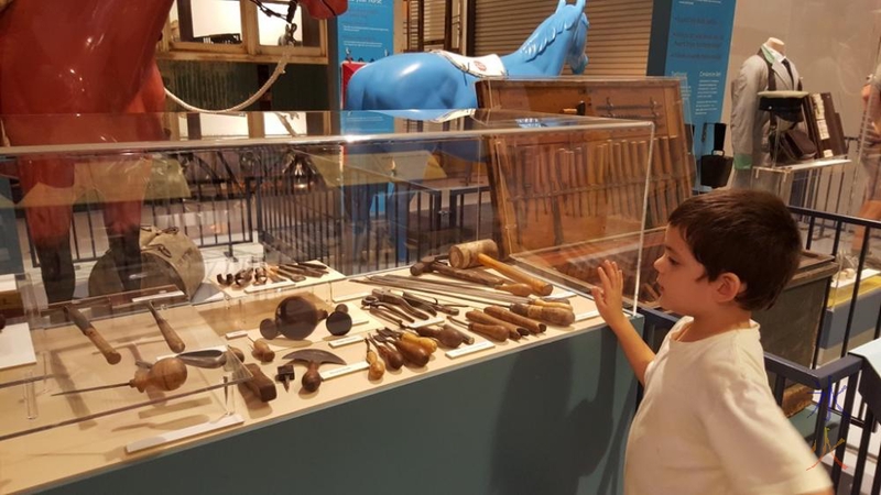 Investigating leatherworking tools at the transport museum at Whiteman Park, Western Australia