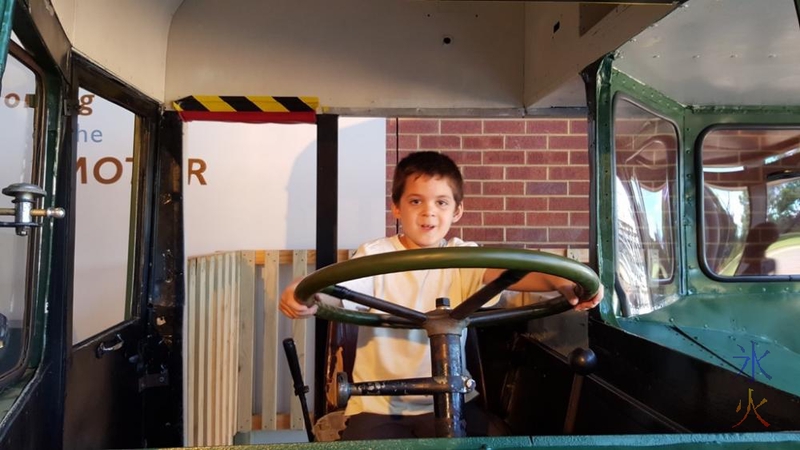 7yo being entirely too gleeful playing in the section of old bus at the transport museum at Whiteman Park, Western Australia