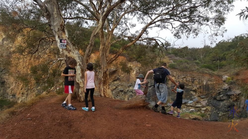 JJ holding on to the two children most likely to plummet over the edge at the top of the quarry