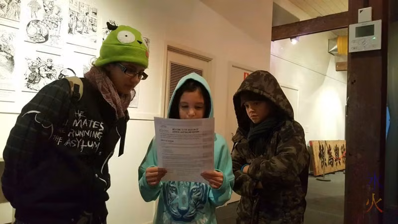 9yo reading overview sheet in one of the galleries at the Chinese Museum, Melbourne, Australia