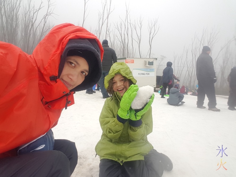 fyn and 11yo with a big snowball, Lake Mountain, Victoria, Australia