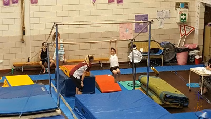 Boys on bar at level 2 gymnastics badge test