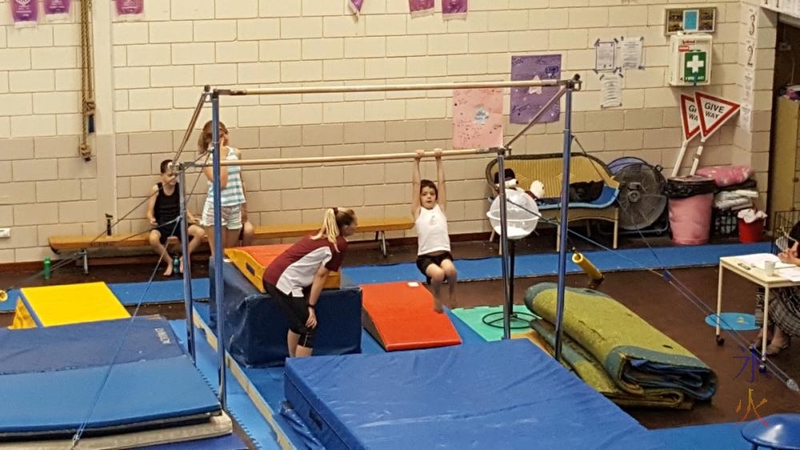 Boys on bar at level 2 gymnastics badge test