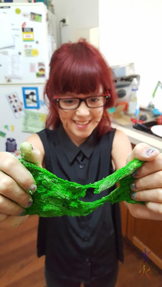 10yo showing off slimy green playdough