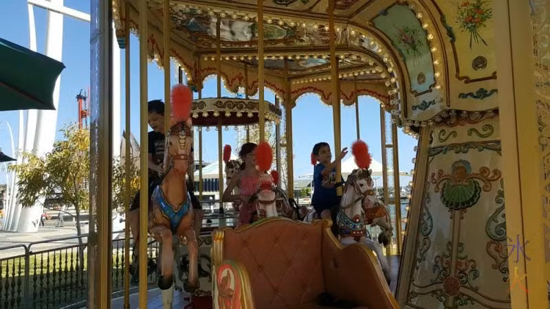 Kids on the carousel at Elizabeth Quay, Perth, Western Australia