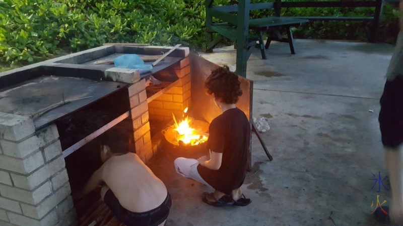 Helping to set up the wokfire, Lily Beach, Christmas Island