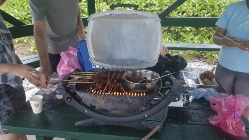 Satays cooking on the barbeque, Lily Beach, Christmas Island