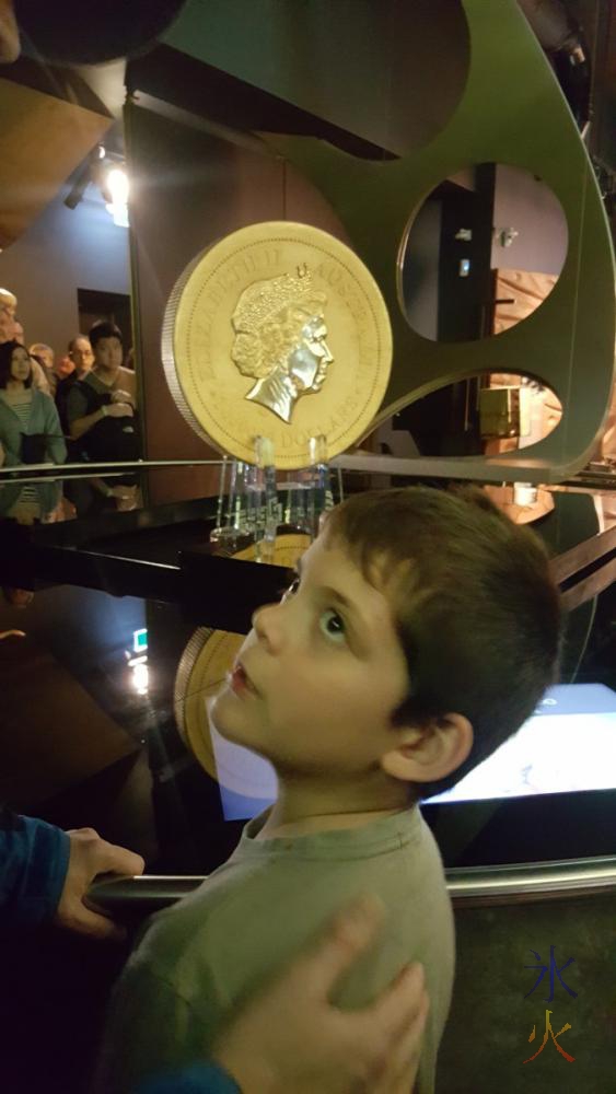 8yo-looking-at-giant-gold-coin-perth-mint