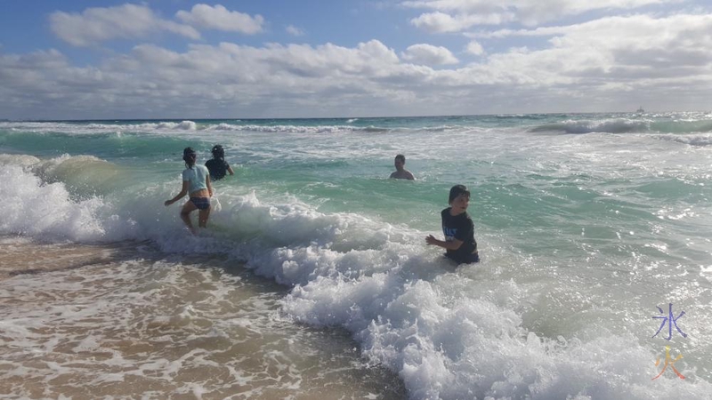 kids-playing-in-waves
