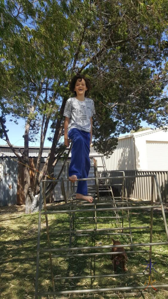 13yo-on-climbing-frame-jurien-beach-house