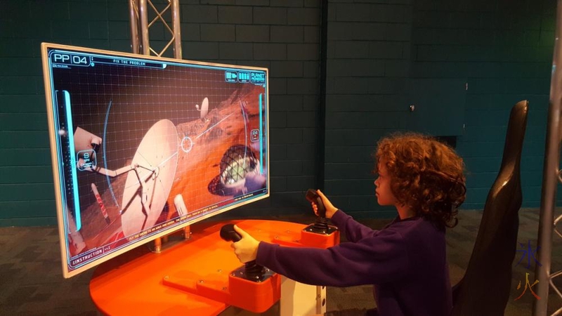 13yo using drone sim at Planet Pioneers exhibition, SciTech, Western Australia