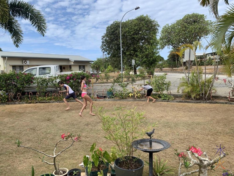 water balloon fight at grandparents place, Christmas Island