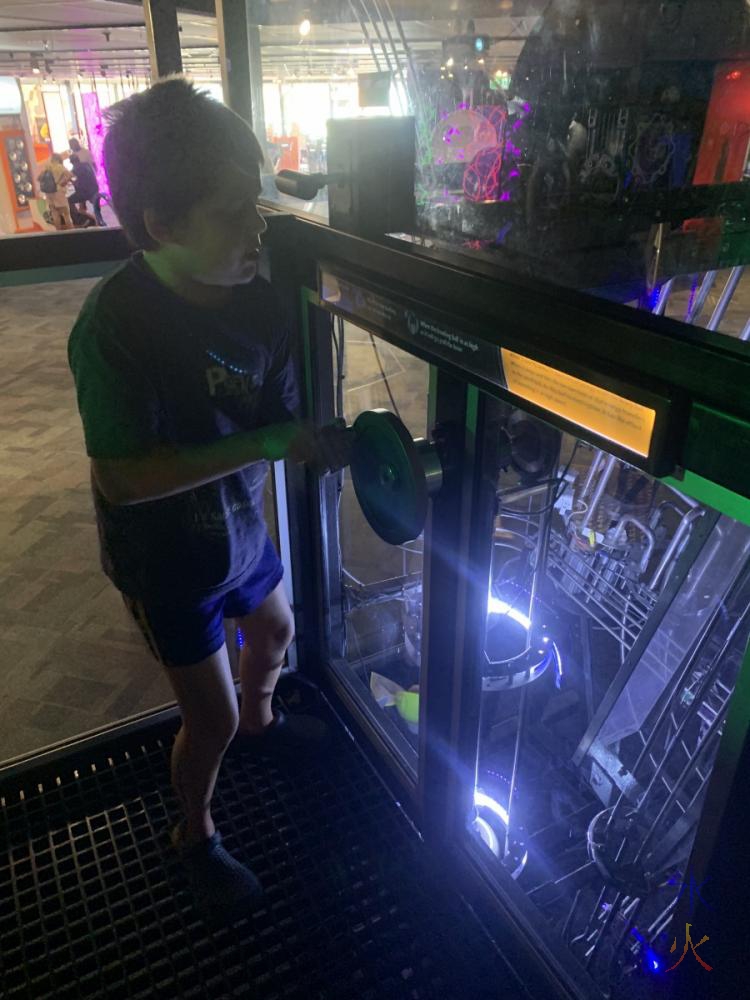 10yo playing with kinetic sculpture, Scitech, Western Australia