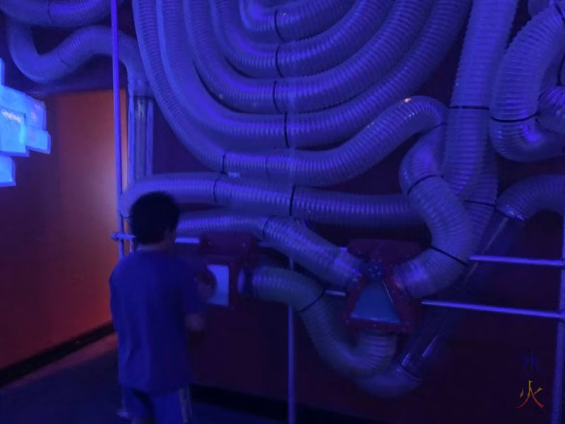 10yo playing with air valve maze at Scitech, Perth, Western Australia