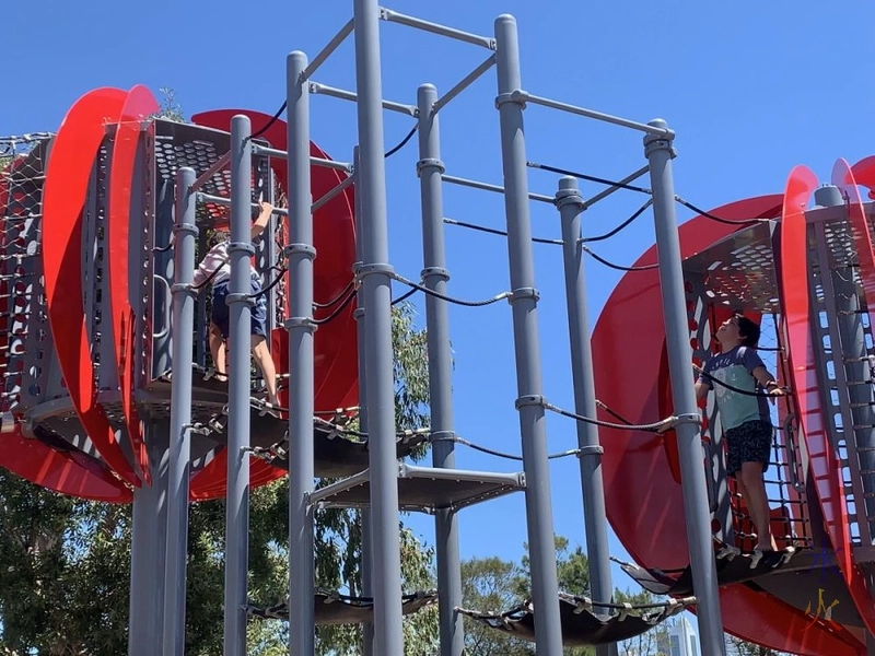 10yo feeling the unfairness of not being tall enough to swing through like 14yo just did