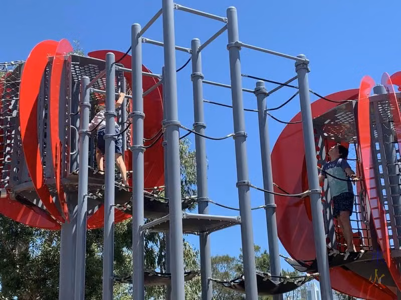 10yo feeling the unfairness of not being tall enough to swing through like 14yo just did
