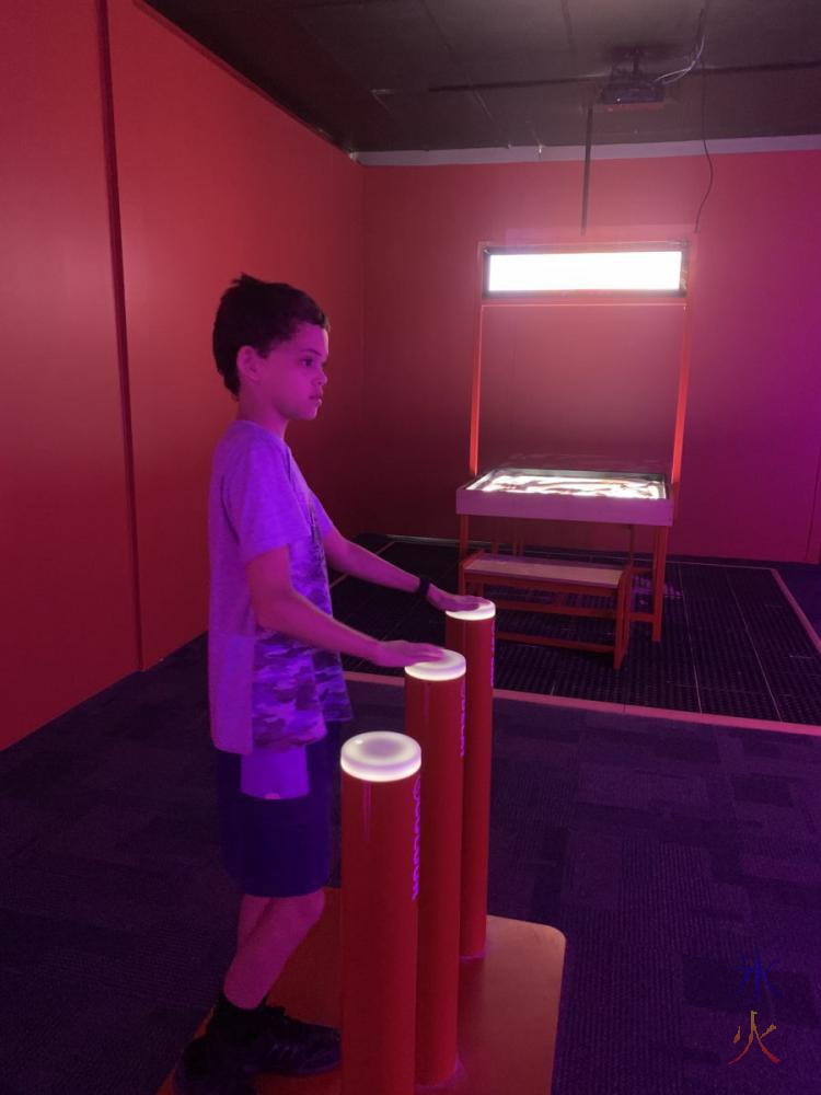 14yo playing with light display at Scitech, Perth, Western Australia