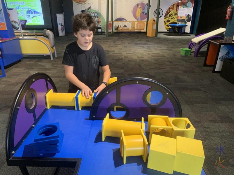 10yo making twisty periscope at Scitech, Perth, Western Australia