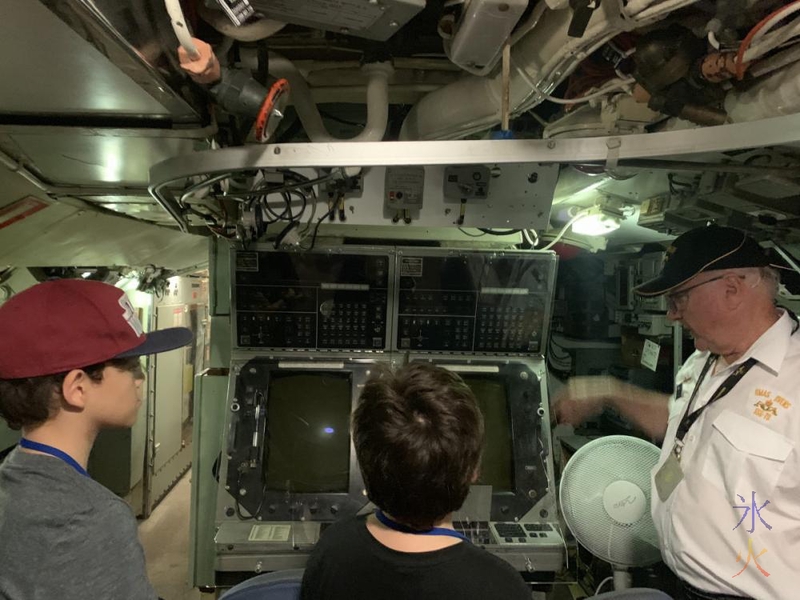 Boys looking at control room equipment on HMAS Ovens, Maritime Museum, Fremantle, Western Australia
