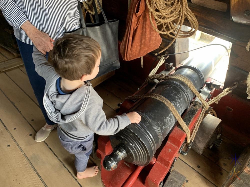 3yo checking out ship cannon aboard Duyfken replica, AQWA, Western Australia