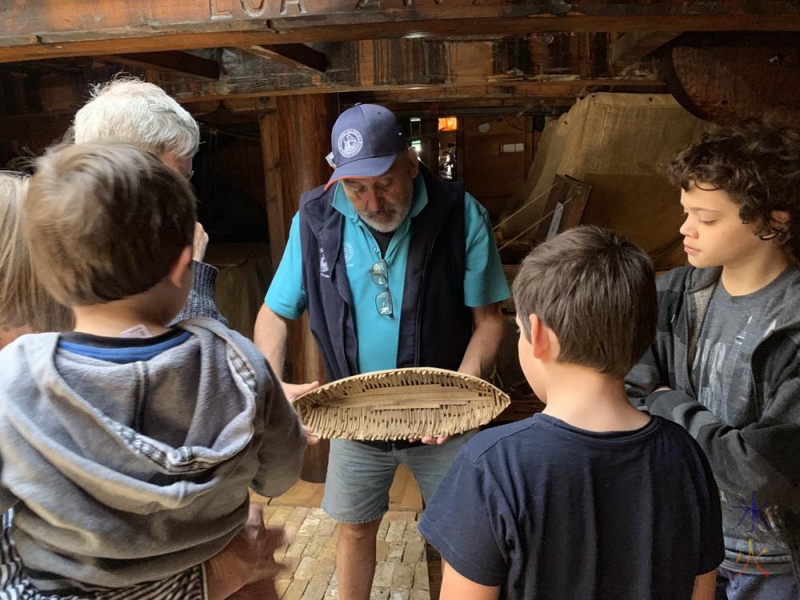 guide showing everyone how boats used to be made using a model aboard the Duyfken replica, AQWA, Western Australia