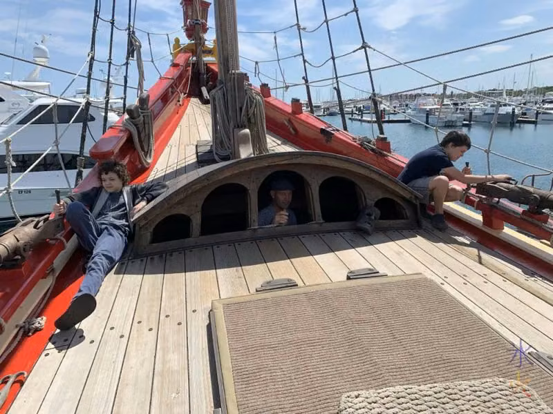14yo and 10yo manning anti-personnel cannons at the back of the Duyfken replica, AQWA, Western Australia