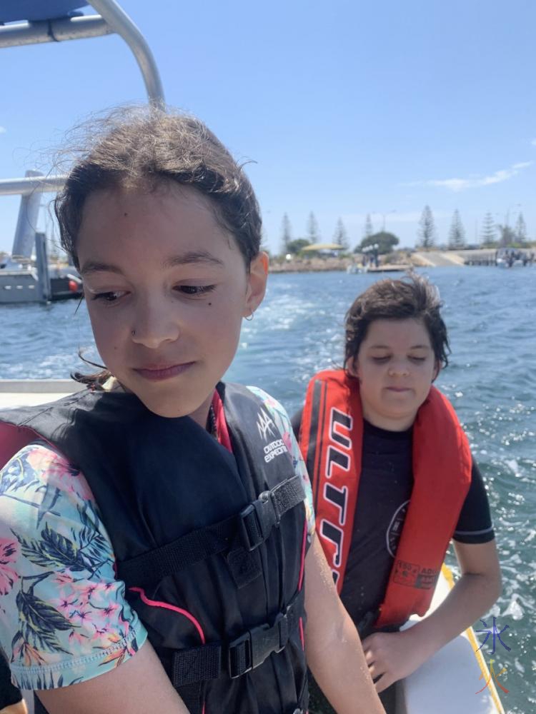 12yo and 10yo on the boat at Jurien Bay